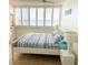 Bright bedroom features large windows with plantation shutters and ocean views at 4453 S Atlantic Ave # 602, Ponce Inlet, FL 32127