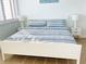 Bright bedroom with large bed and bedside tables at 4453 S Atlantic Ave # 602, Ponce Inlet, FL 32127