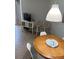 Inviting dining area with wicker stools, a charming side table, and a round wooden dining table at 4453 S Atlantic Ave # 602, Ponce Inlet, FL 32127