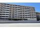 Exterior view of a beachfront condo with multiple floors and balconies at 4453 S Atlantic Ave # 602, Ponce Inlet, FL 32127
