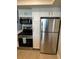 Kitchen with stainless steel appliances and ample white cabinet storage at 4453 S Atlantic Ave # 602, Ponce Inlet, FL 32127