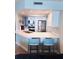 The well-equipped kitchen features stainless appliances, white cabinets, and a breakfast bar for casual dining at 4453 S Atlantic Ave # 602, Ponce Inlet, FL 32127
