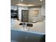 Updated kitchen with stainless appliances and white cabinetry and quartz countertops at 4453 S Atlantic Ave # 602, Ponce Inlet, FL 32127