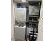 Stacked washer and dryer set in compact laundry closet at 4453 S Atlantic Ave # 602, Ponce Inlet, FL 32127