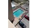 Aerial view of a large swimming pool surrounded by sunbathers and a parking lot at 4453 S Atlantic Ave # 602, Ponce Inlet, FL 32127