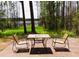 Relaxing outdoor patio with seating overlooking the lush backyard and scenic waterfront at 548 Glen Haven Dr, Deltona, FL 32738