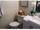 This is a half bath with a pedestal sink and white commode with storage at 548 Glen Haven Dr, Deltona, FL 32738