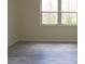 Spacious bedroom with hardwood floors and large windows overlooking the backyard at 548 Glen Haven Dr, Deltona, FL 32738