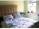 Bright bedroom featuring comfortable bed, contemporary décor, and ample natural light from the window at 548 Glen Haven Dr, Deltona, FL 32738