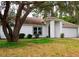 Charming one-story home with mature trees, a two car garage, and well-maintained landscaping at 548 Glen Haven Dr, Deltona, FL 32738