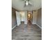 Bedroom featuring wood-look floors, neutral paint, closet, and a ceiling fan at 5540 Devonbriar Way # 103, Orlando, FL 32822