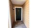 Charming front door entrance with a welcome mat and ample lighting, inviting guests inside at 5540 Devonbriar Way # 103, Orlando, FL 32822