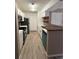 Updated kitchen with modern appliances, sleek countertops, and ample cabinet space at 5540 Devonbriar Way # 103, Orlando, FL 32822