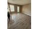 Cozy living room with a fireplace, and light-filled windows, perfect for relaxation at 5540 Devonbriar Way # 103, Orlando, FL 32822
