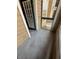 Covered patio with concrete flooring looks out at a fenced area at 5540 Devonbriar Way # 103, Orlando, FL 32822