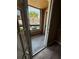 Enclosed patio with views of the surrounding community from inside the screened-in room at 5540 Devonbriar Way # 103, Orlando, FL 32822