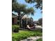 Outdoor playground for children with surrounding apartment buildings at 5540 Devonbriar Way # 103, Orlando, FL 32822