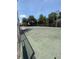 Outdoor tennis court ready for a match at 5540 Devonbriar Way # 103, Orlando, FL 32822