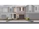 New townhome boasts gray brick facade, garage, lush landscaping and sidewalks for pedestrian-friendly living at 560 Southern Edge Way, Sanford, FL 32771