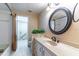 Bright bathroom with a large vanity mirror, drawers, and modern fixtures at 607 W Club Blvd, Lake Mary, FL 32746