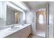 Bathroom featuring double sinks, a large mirror, and ample storage space in the vanity at 607 W Club Blvd, Lake Mary, FL 32746