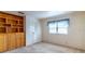 Carpeted bedroom with a built-in bookcase and storage cabinets at 607 W Club Blvd, Lake Mary, FL 32746