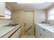 Laundry area with side-by-side machines, a utility sink, and counter space at 607 W Club Blvd, Lake Mary, FL 32746