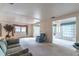 Bright living area with plush carpet, comfortable seating, and neutral-toned walls and trim at 607 W Club Blvd, Lake Mary, FL 32746