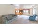 Spacious living room with neutral carpet, comfortable seating, and bright natural light at 607 W Club Blvd, Lake Mary, FL 32746