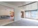 Bright sunroom with white vertical blinds and natural light, open to the living area at 607 W Club Blvd, Lake Mary, FL 32746