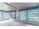 Bright sunroom with white vertical blinds and natural light, providing a relaxing space at 607 W Club Blvd, Lake Mary, FL 32746