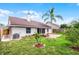 Charming home's backyard with a brick patio and verdant green space at 635 Holbrook Cir, Lake Mary, FL 32746