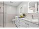 Beautiful bathroom with a double sink vanity, illuminated mirror and glass enclosed shower at 635 Holbrook Cir, Lake Mary, FL 32746