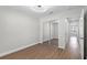 Bedroom with hardwood floors featuring a mirror closet at 635 Holbrook Cir, Lake Mary, FL 32746