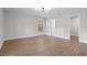 Neutral bedroom with hardwood floors and a large window at 635 Holbrook Cir, Lake Mary, FL 32746