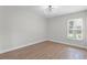 Bedroom with hardwood flooring and a modern light fixture at 635 Holbrook Cir, Lake Mary, FL 32746