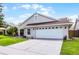Charming single-story home featuring a well-maintained lawn and a two-car garage, under a sunny sky at 635 Holbrook Cir, Lake Mary, FL 32746