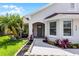 Close-up of a charming single-story home featuring a well-maintained lawn and meticulously landscaped entryway at 635 Holbrook Cir, Lake Mary, FL 32746