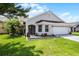 Charming single-story home featuring a well-maintained lawn and meticulously landscaped entryway at 635 Holbrook Cir, Lake Mary, FL 32746