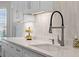 Modern kitchen featuring quartz countertops, stainless steel faucet, and bright white cabinetry at 635 Holbrook Cir, Lake Mary, FL 32746