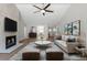 Bright and airy living room featuring a fireplace and a comfortable seating area at 635 Holbrook Cir, Lake Mary, FL 32746