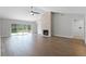 Spacious living room with fireplace, high ceilings, wood floors, and sliding glass doors at 635 Holbrook Cir, Lake Mary, FL 32746