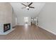 Expansive living room showcasing fireplace, open layout, and wood flooring at 635 Holbrook Cir, Lake Mary, FL 32746