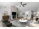 Spacious living room featuring a fireplace, vaulted ceilings, and an open floor plan, ideal for relaxation and entertainment at 635 Holbrook Cir, Lake Mary, FL 32746
