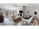 Spacious living room with modern fireplace, vaulted ceilings, and ample natural light at 635 Holbrook Cir, Lake Mary, FL 32746