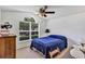 Comfortable bedroom featuring a vaulted ceiling, large window, and ample natural light at 638 Sun Bluff Ln, Apopka, FL 32712