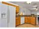 Well-equipped kitchen with granite counters, wood cabinetry, and modern appliances for convenient cooking at 638 Sun Bluff Ln, Apopka, FL 32712
