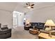 Spacious living room featuring vaulted ceilings, comfortable seating, and ample natural light at 638 Sun Bluff Ln, Apopka, FL 32712