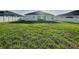 Expansive backyard with lush green lawn and privacy fencing, great for outdoor activities at 6686 Treymont Dr, Lakeland, FL 33813