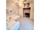 Neutral-toned bedroom featuring a cozy white couch and a dedicated workspace in the closet at 6686 Treymont Dr, Lakeland, FL 33813